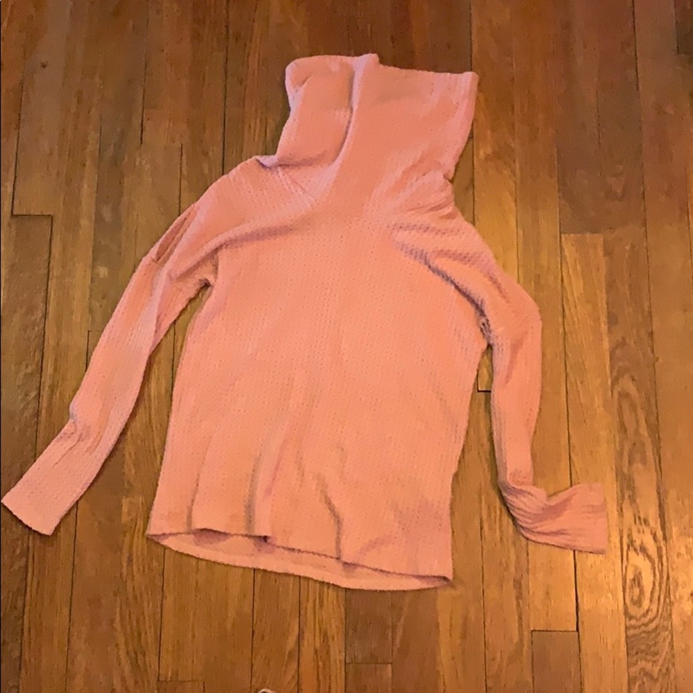 Pink turtleneck with slits in the bicep area